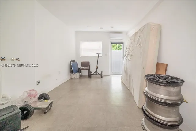 a room with a chair and gym equipment