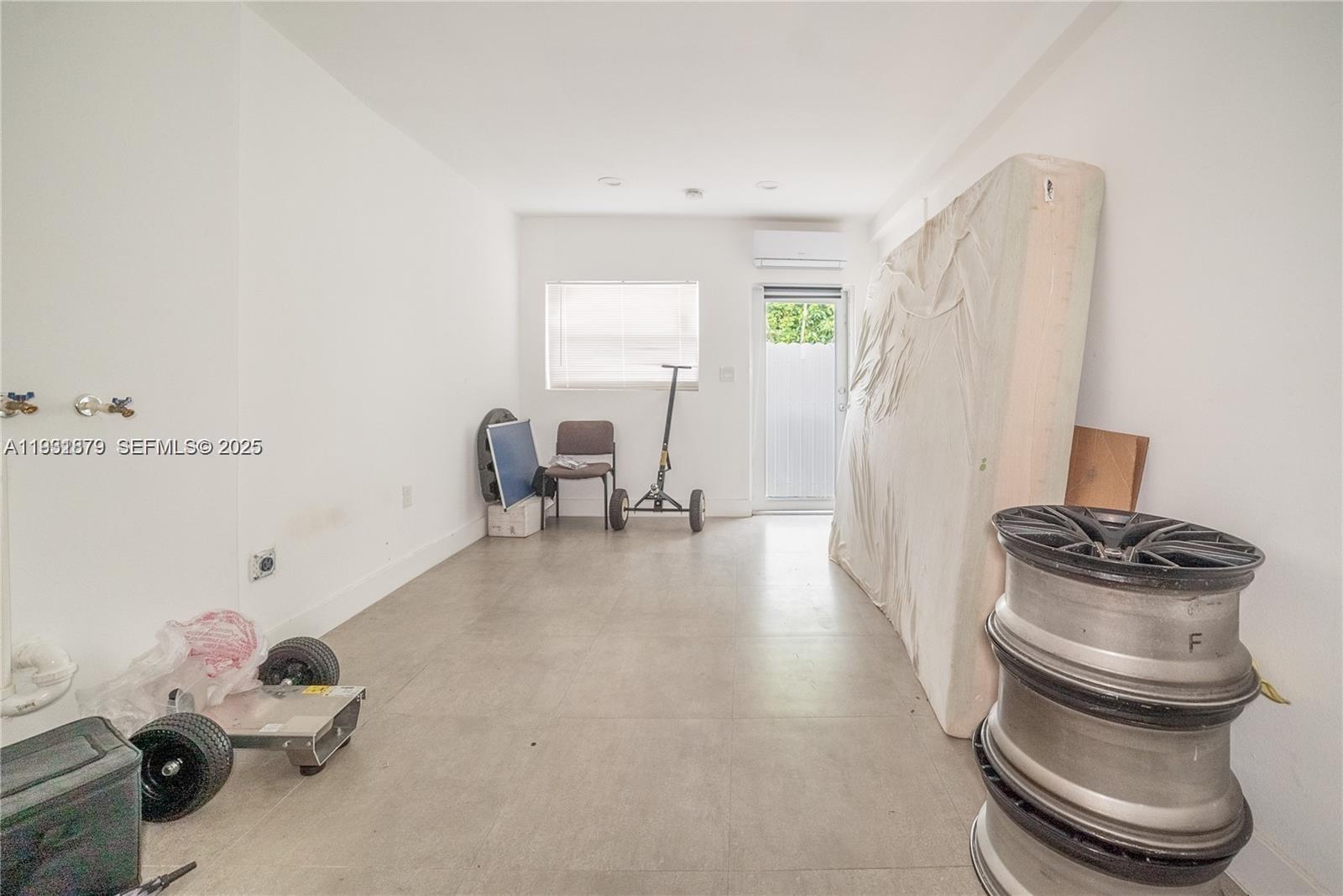 2501 Northwest 22nd Avenue Miami, FL 33142 - Photo 28 of 43 a room with a chair and gym equipment