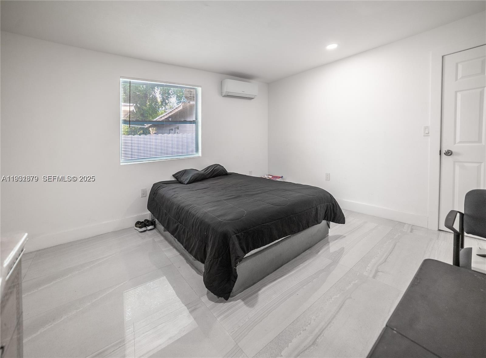 2501 Northwest 22nd Avenue Miami, FL 33142 - Photo 31 of 43 a bedroom with a bed and a couch