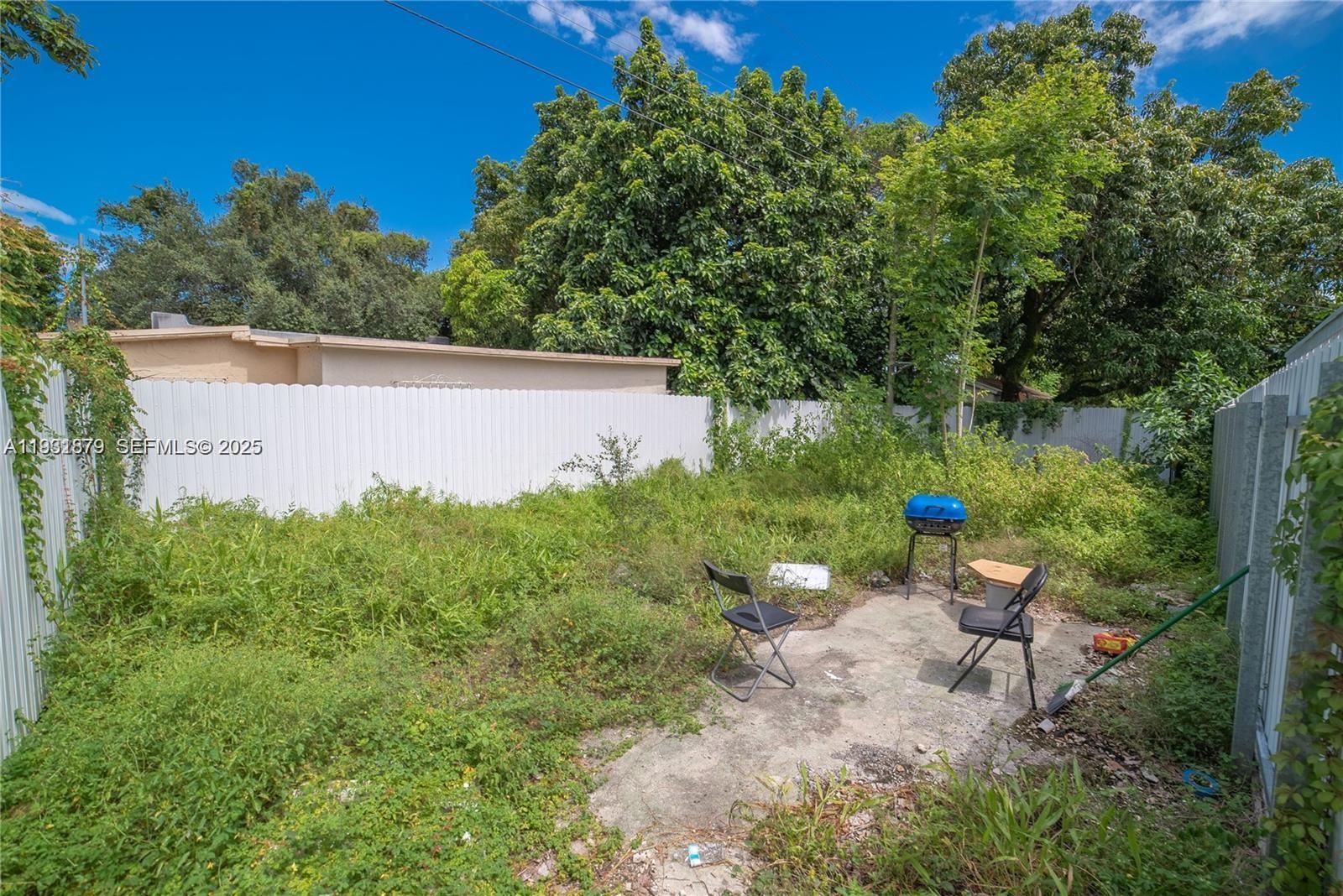 2501 Northwest 22nd Avenue Miami, FL 33142 - Photo 43 of 43 a backyard of a house with lots of green space and garden
