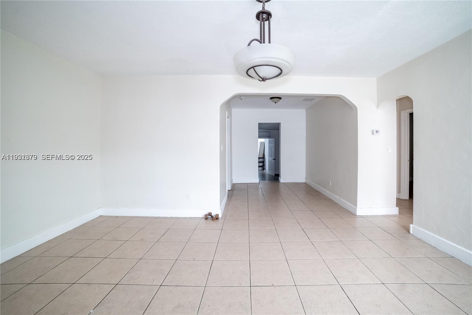 2501 Northwest 22nd Avenue Miami, FL 33142 - Photo 9 of 43 a view of a room with a hallway
