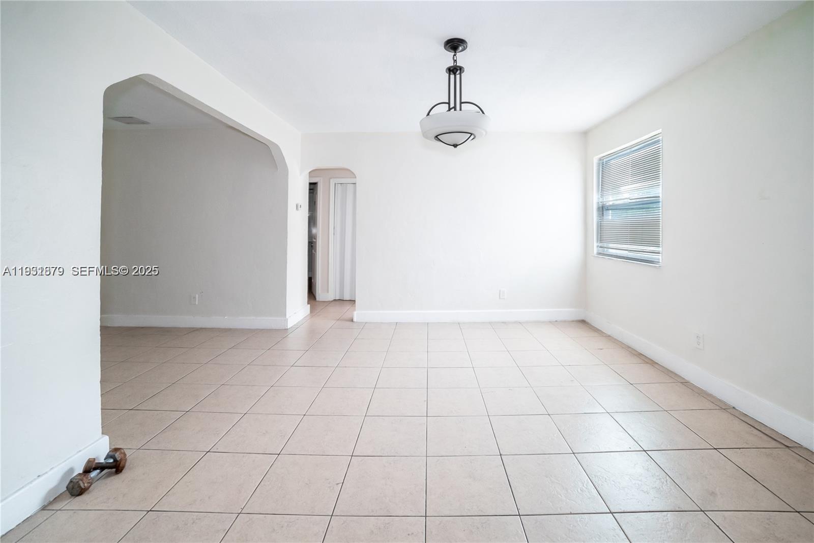 2501 Northwest 22nd Avenue Miami, FL 33142 - Photo 10 of 43 a view of an empty room with a window