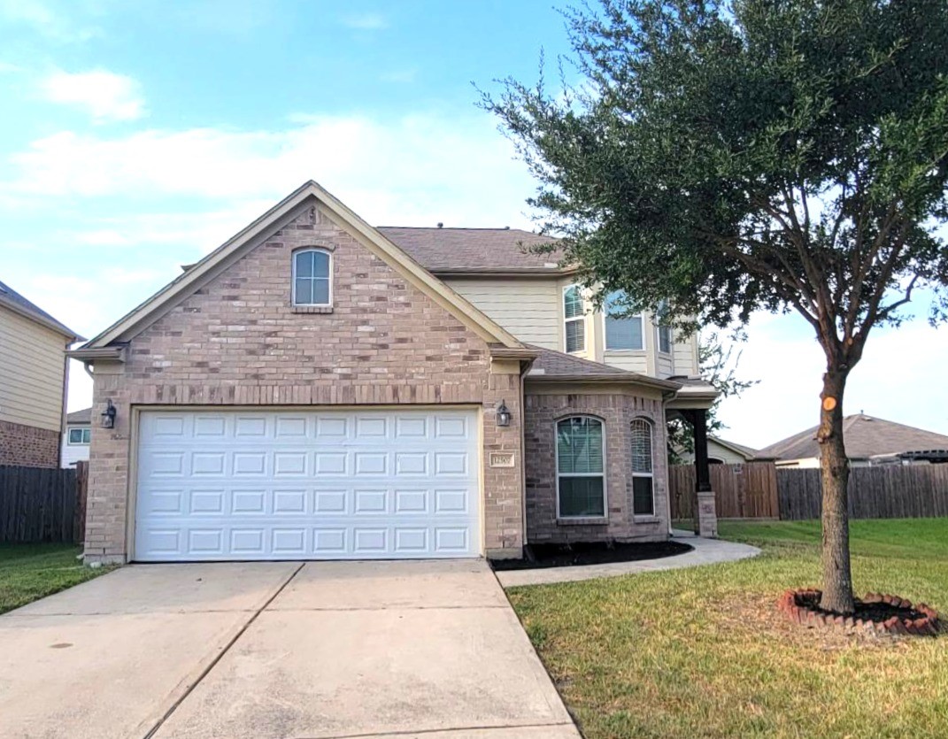 12507 Kings Pond Court Houston, TX 77044 - Photo 1 of 10 a view of a house with a yard