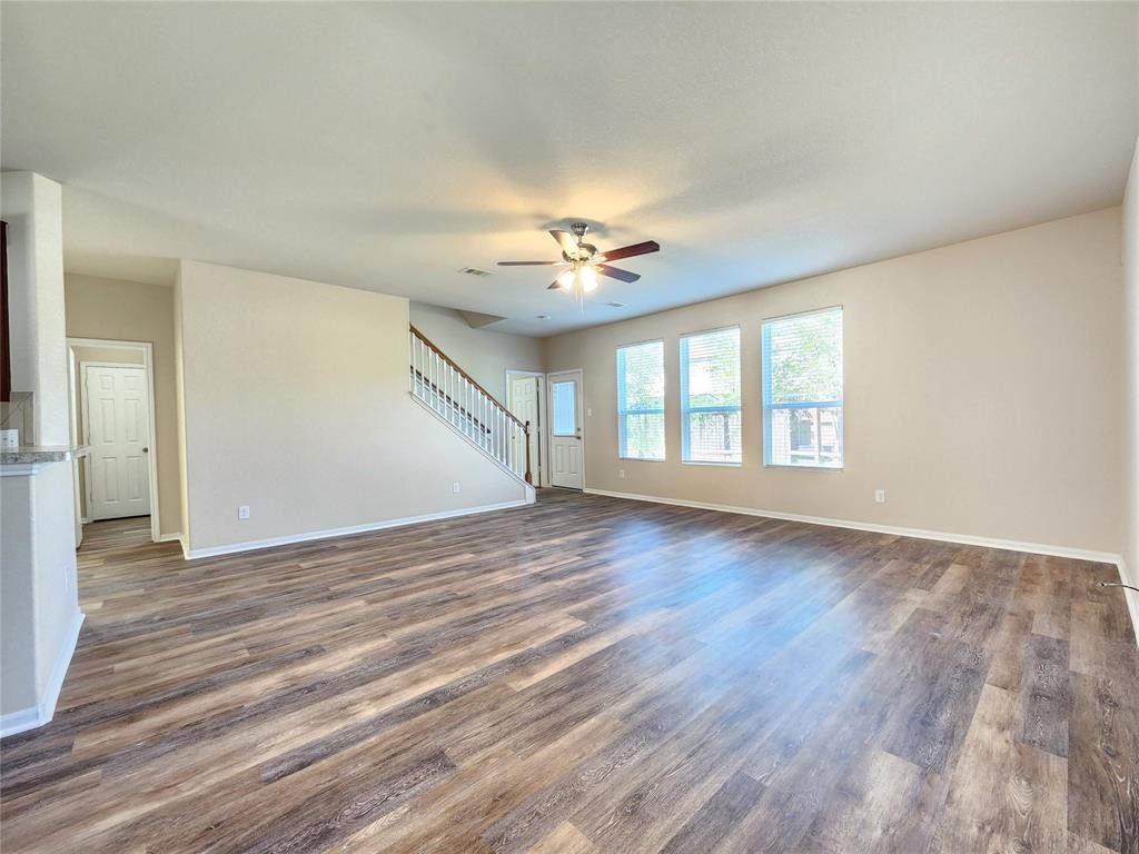 12507 Kings Pond Court Houston, TX 77044 - Photo 4 of 10 wooden floor in an empty room with a window