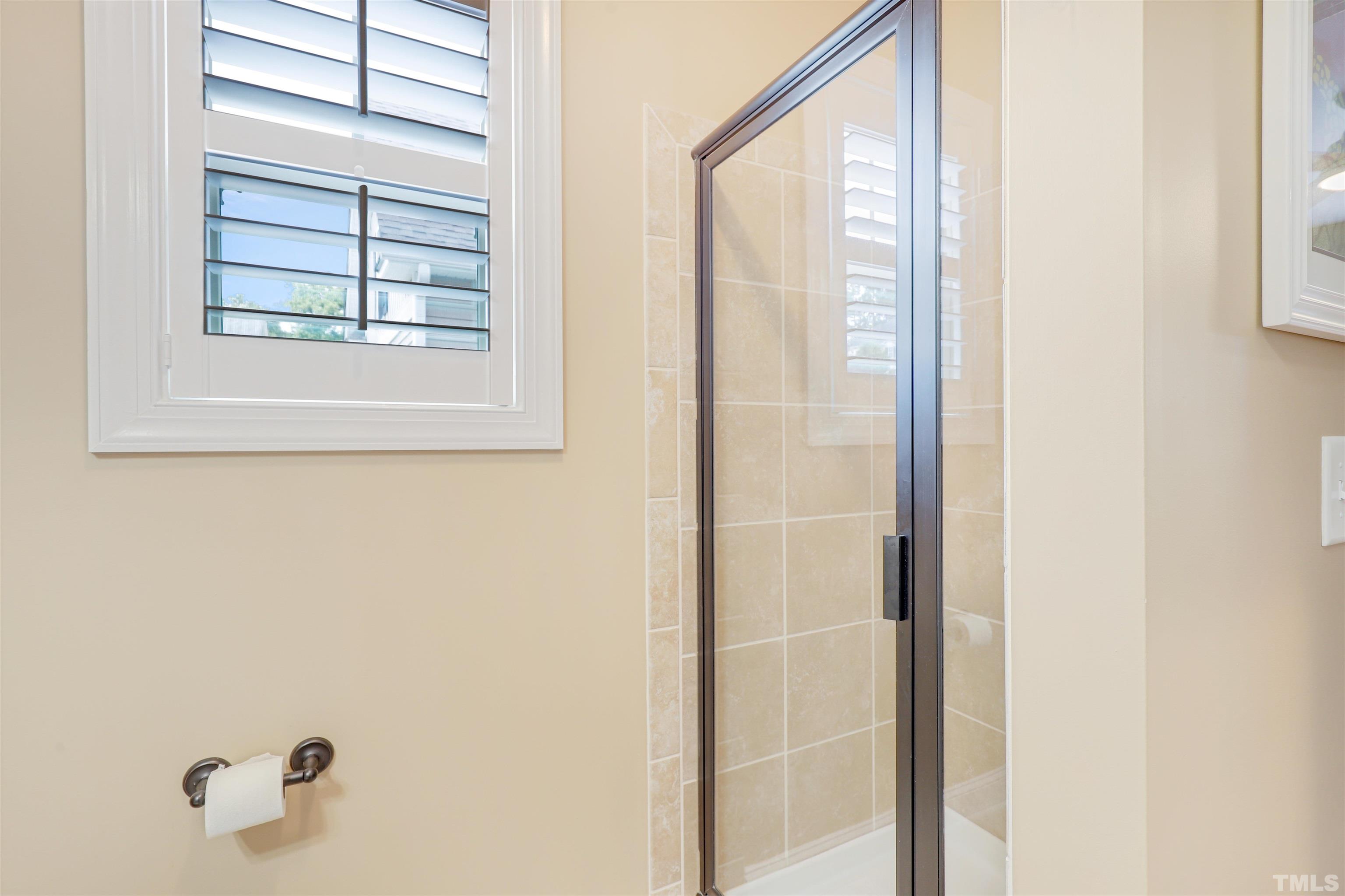 4312 Glengrove Road Raleigh, NC 27616 - Photo 20 of 50 a bathroom with a window and a shower