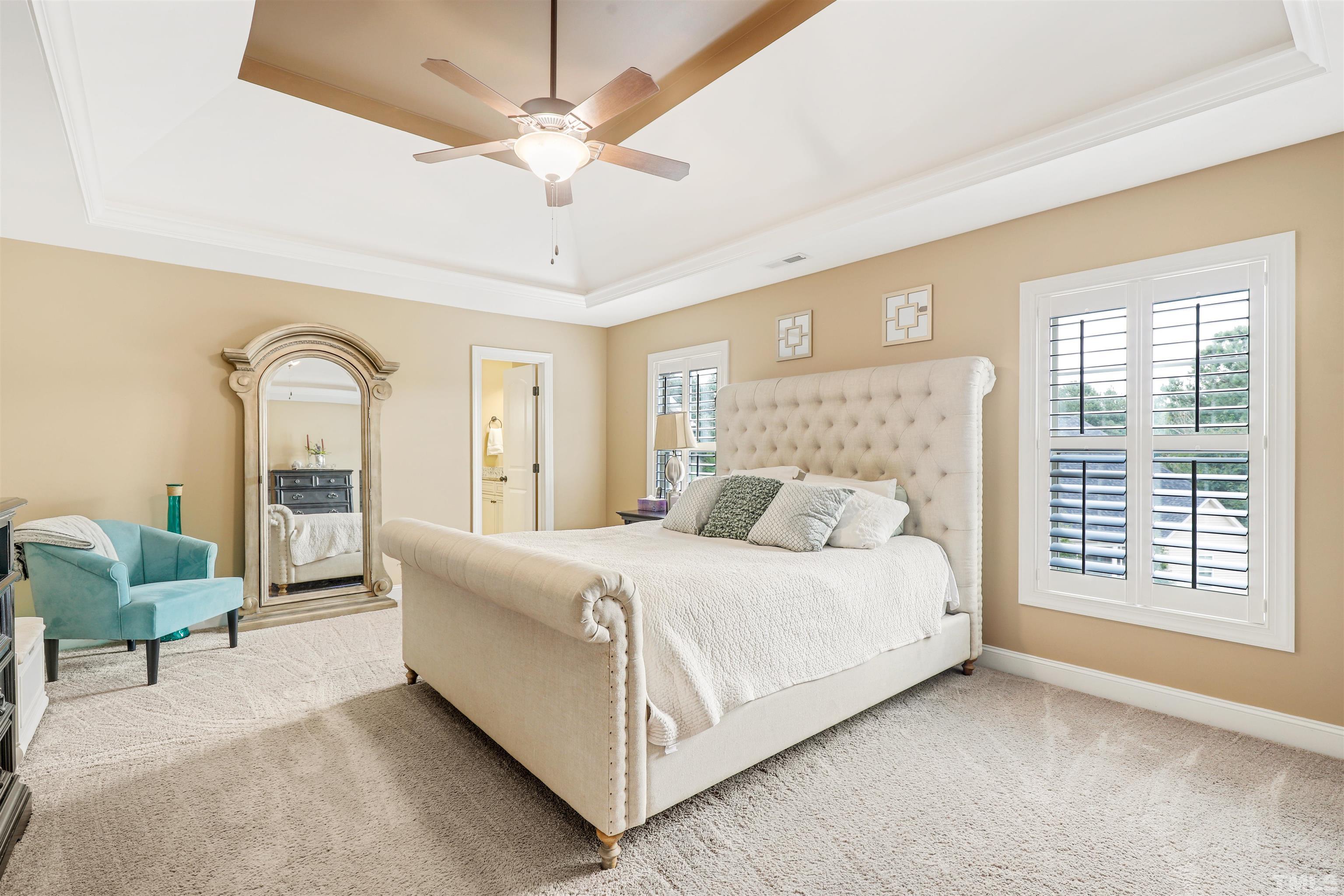 4312 Glengrove Road Raleigh, NC 27616 - Photo 22 of 50 a bedroom with a large bed and ceiling fan