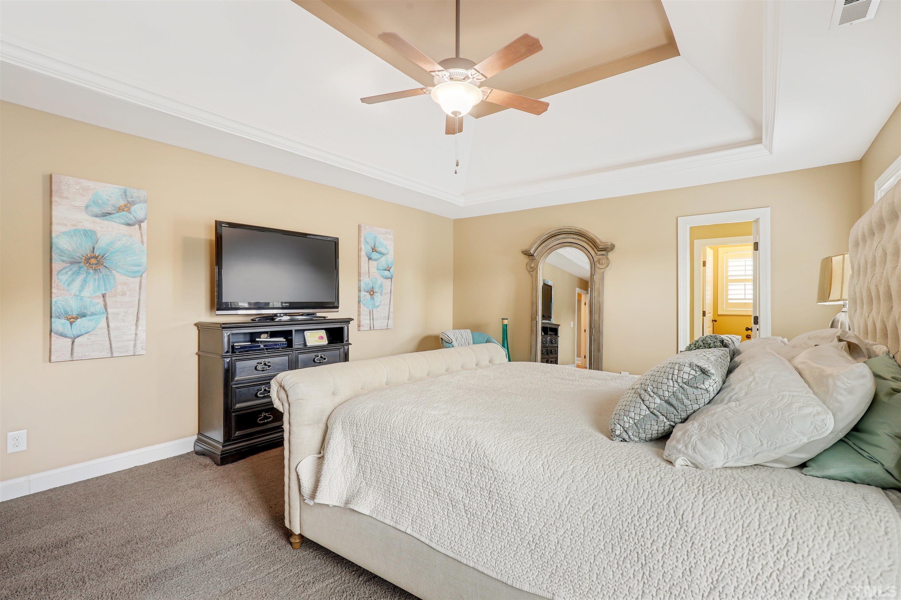 4312 Glengrove Road Raleigh, NC 27616 - Photo 23 of 50 a bedroom with a bed and a flat screen tv