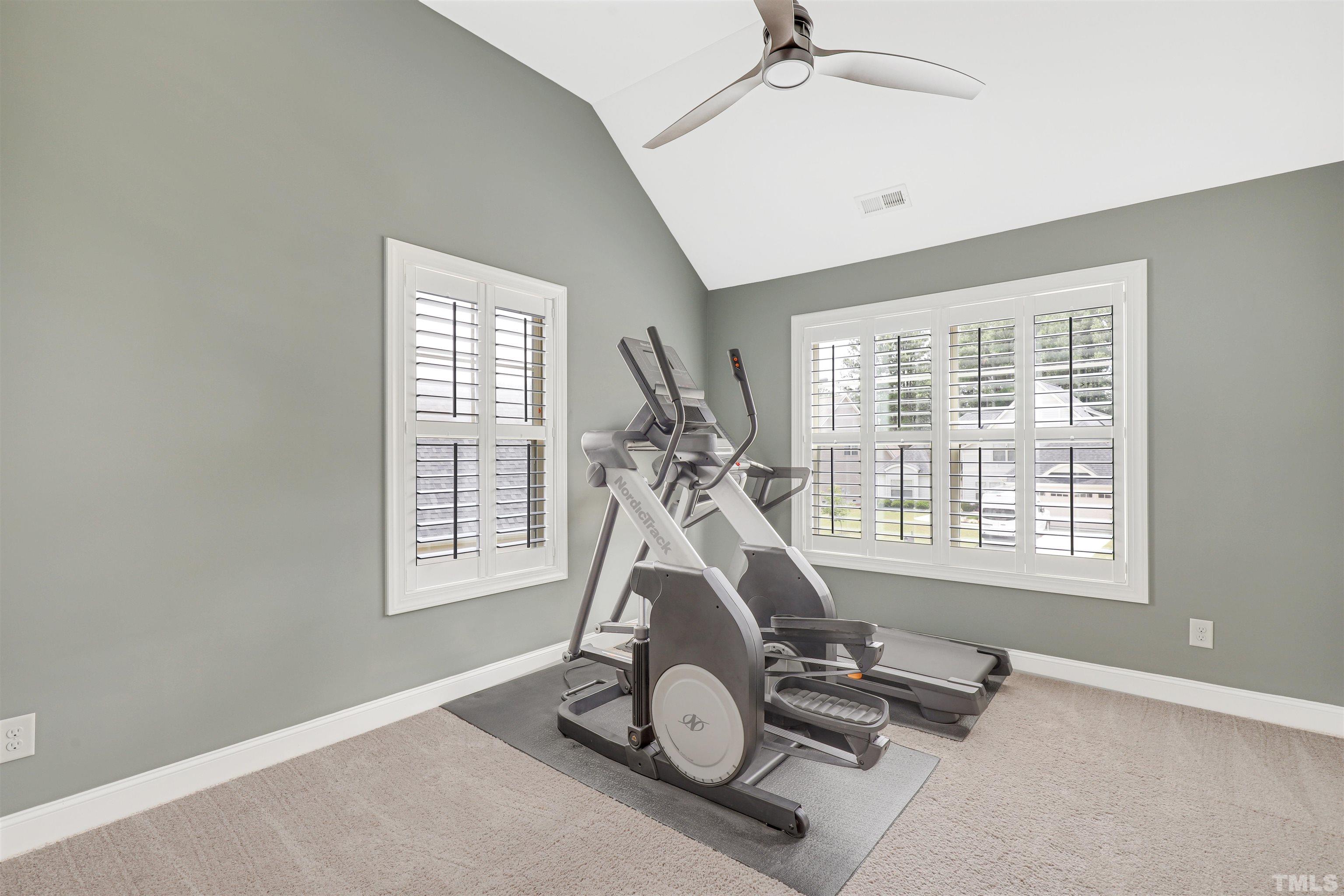 4312 Glengrove Road Raleigh, NC 27616 - Photo 28 of 50 a room with gym equipment and windows