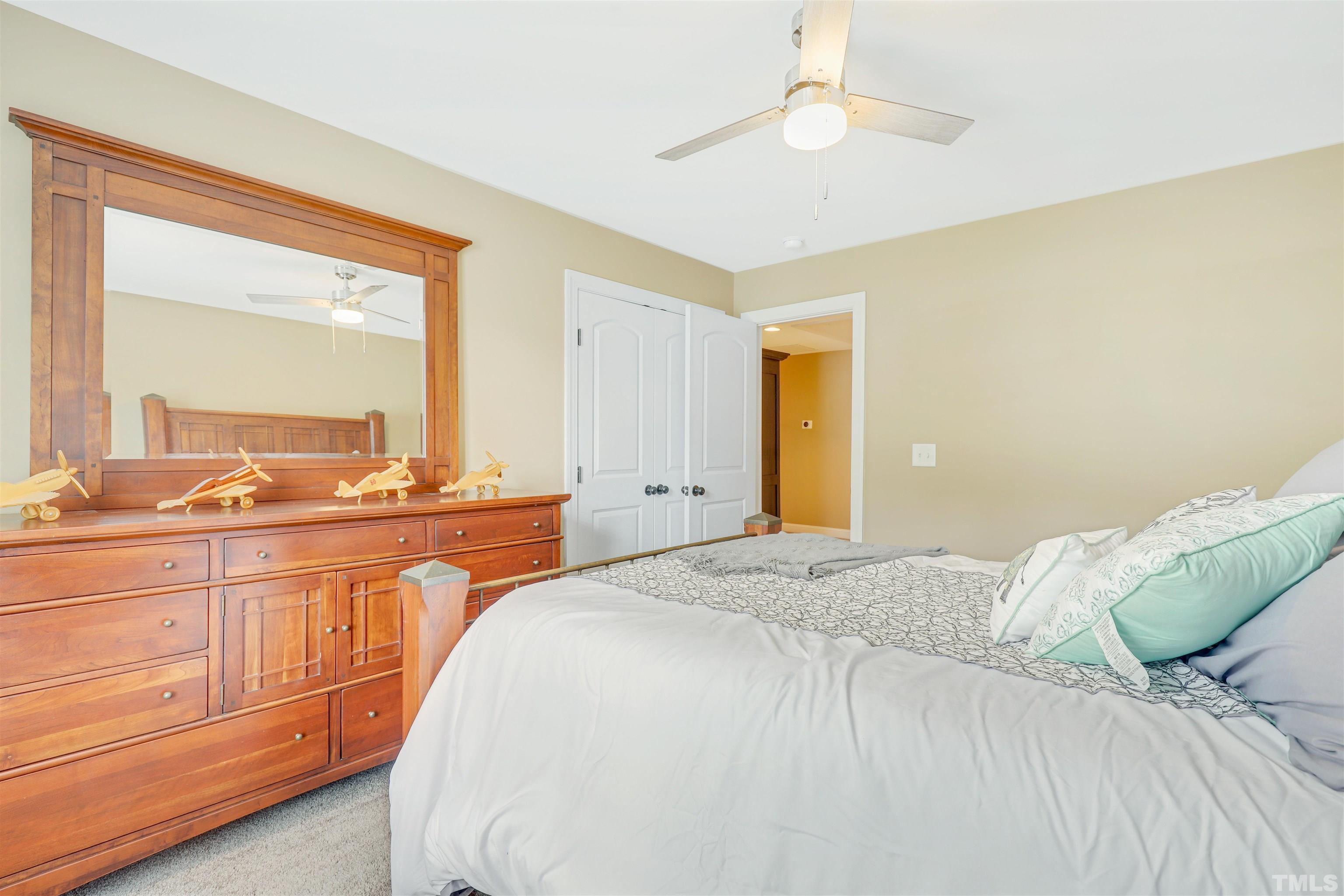 4312 Glengrove Road Raleigh, NC 27616 - Photo 39 of 50 a spacious bedroom with a bed and a dresser
