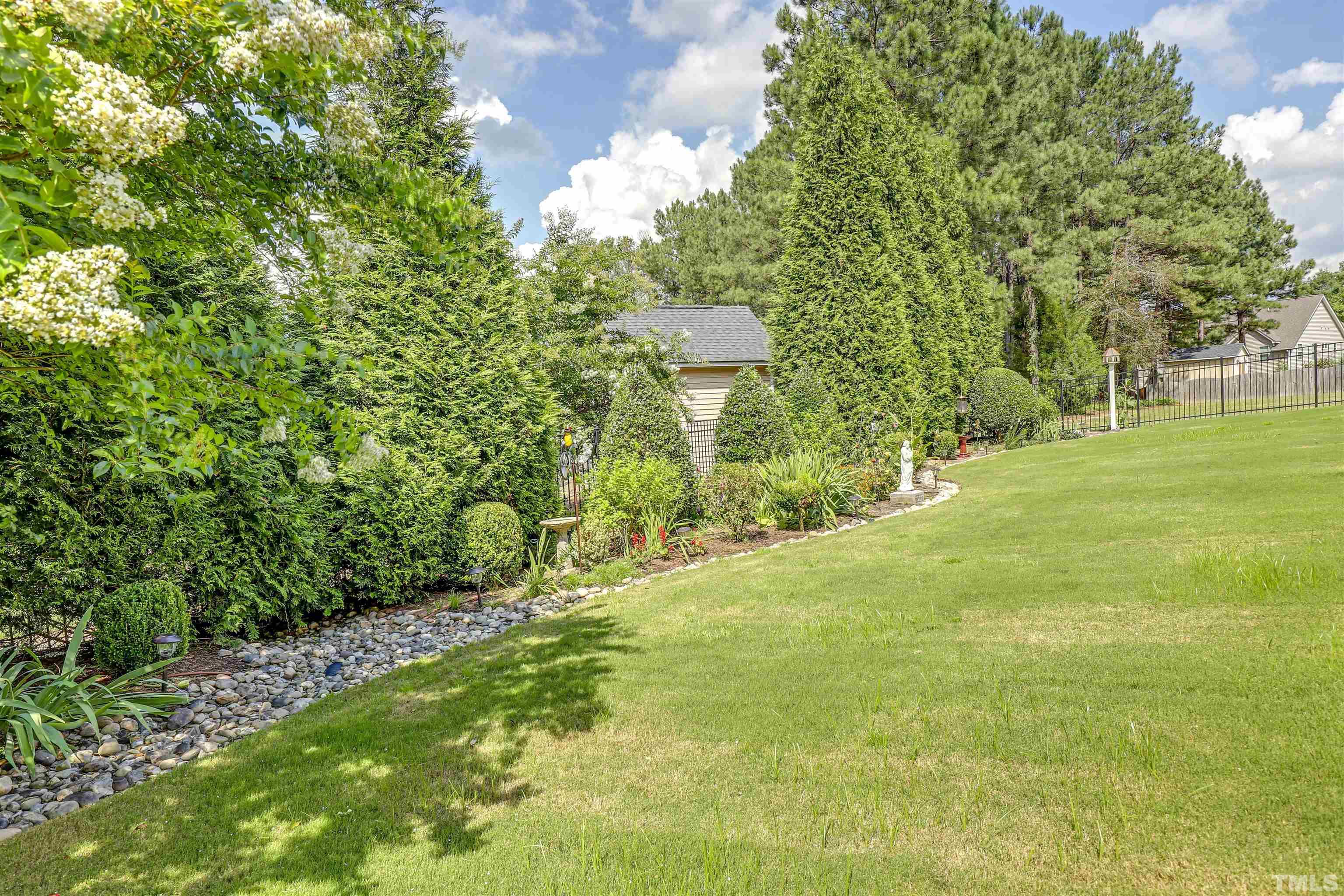 4312 Glengrove Road Raleigh, NC 27616 - Photo 47 of 50 a view of a yard with a tree