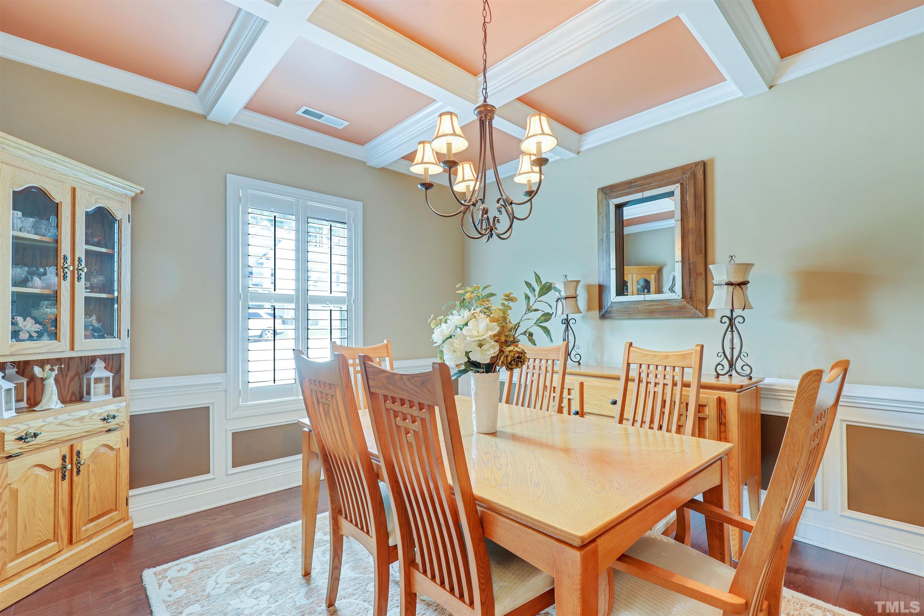 4312 Glengrove Road Raleigh, NC 27616 - Photo 5 of 50 a view of a dining room with furniture a chandelier and wooden floor