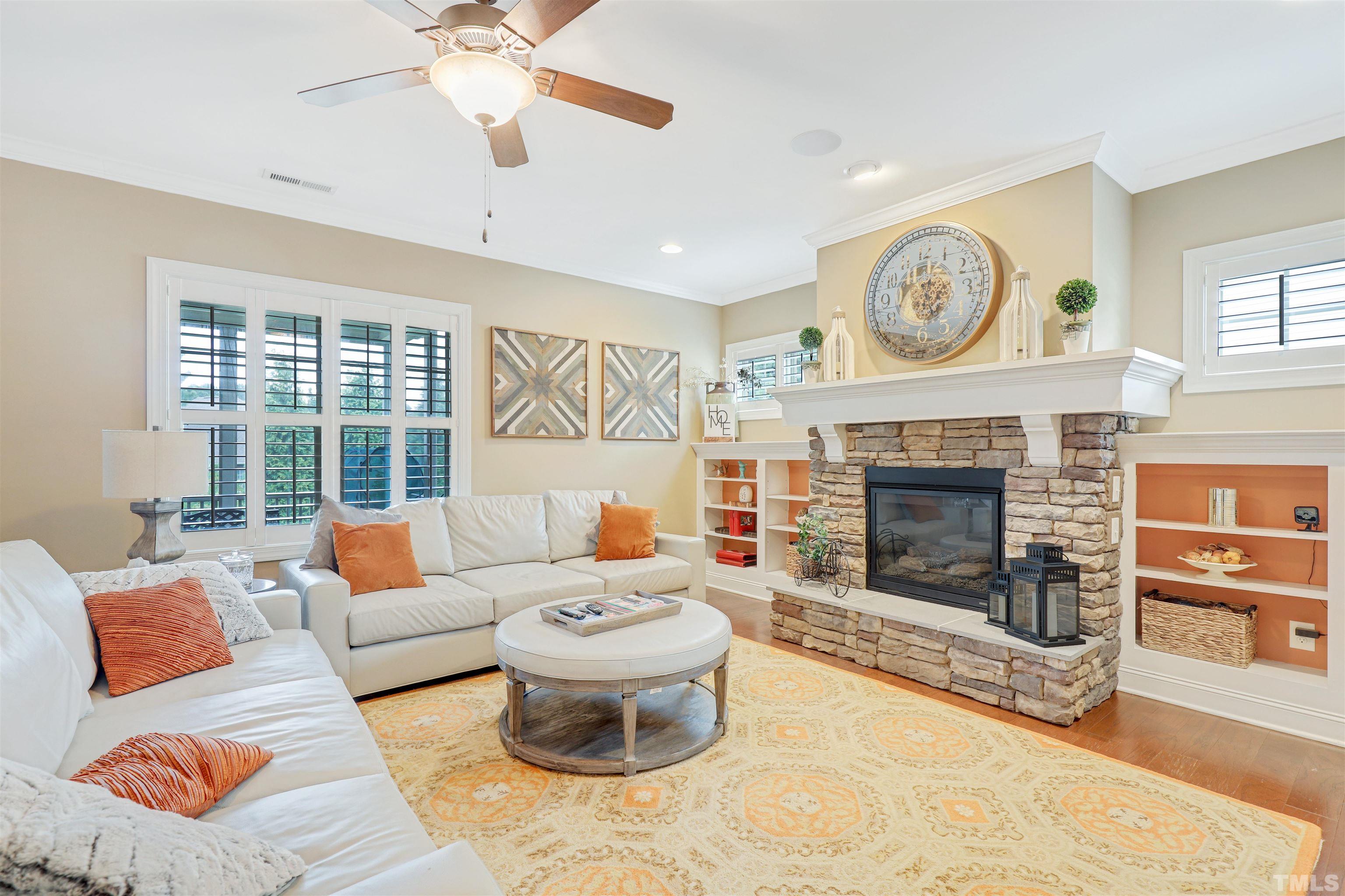4312 Glengrove Road Raleigh, NC 27616 - Photo 7 of 50 a living room with furniture a window and a fireplace