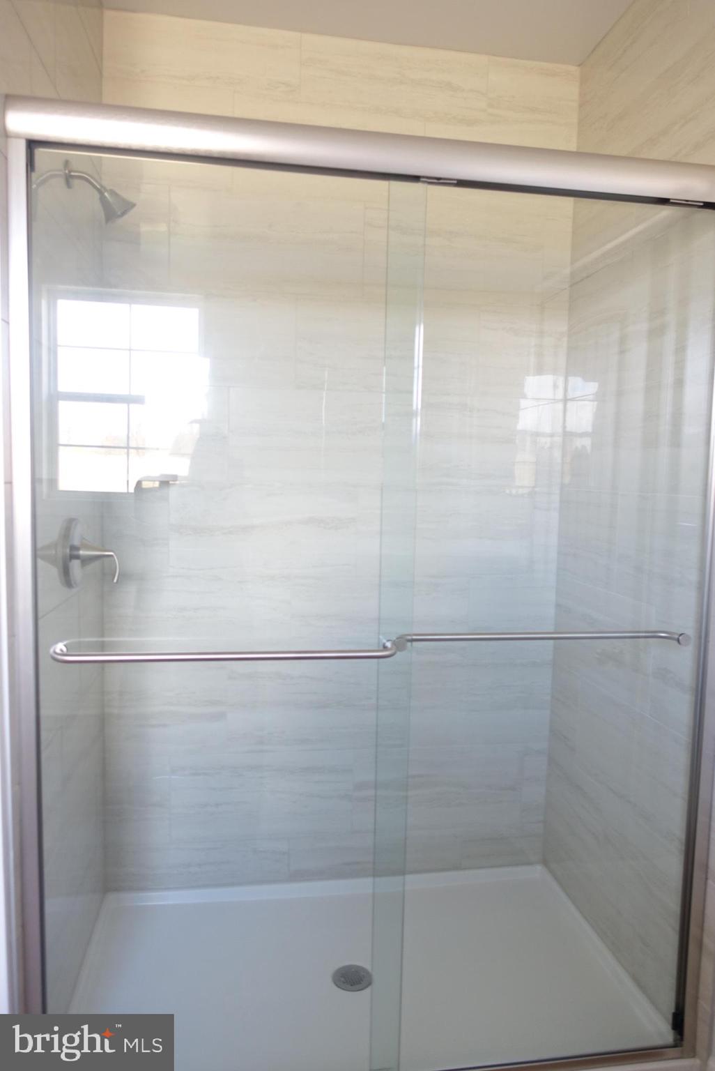 310 Steeple View Drive, Unit 18 Hanover, PA 17331 - Photo 14 of 24 a bathroom with a glass shower door