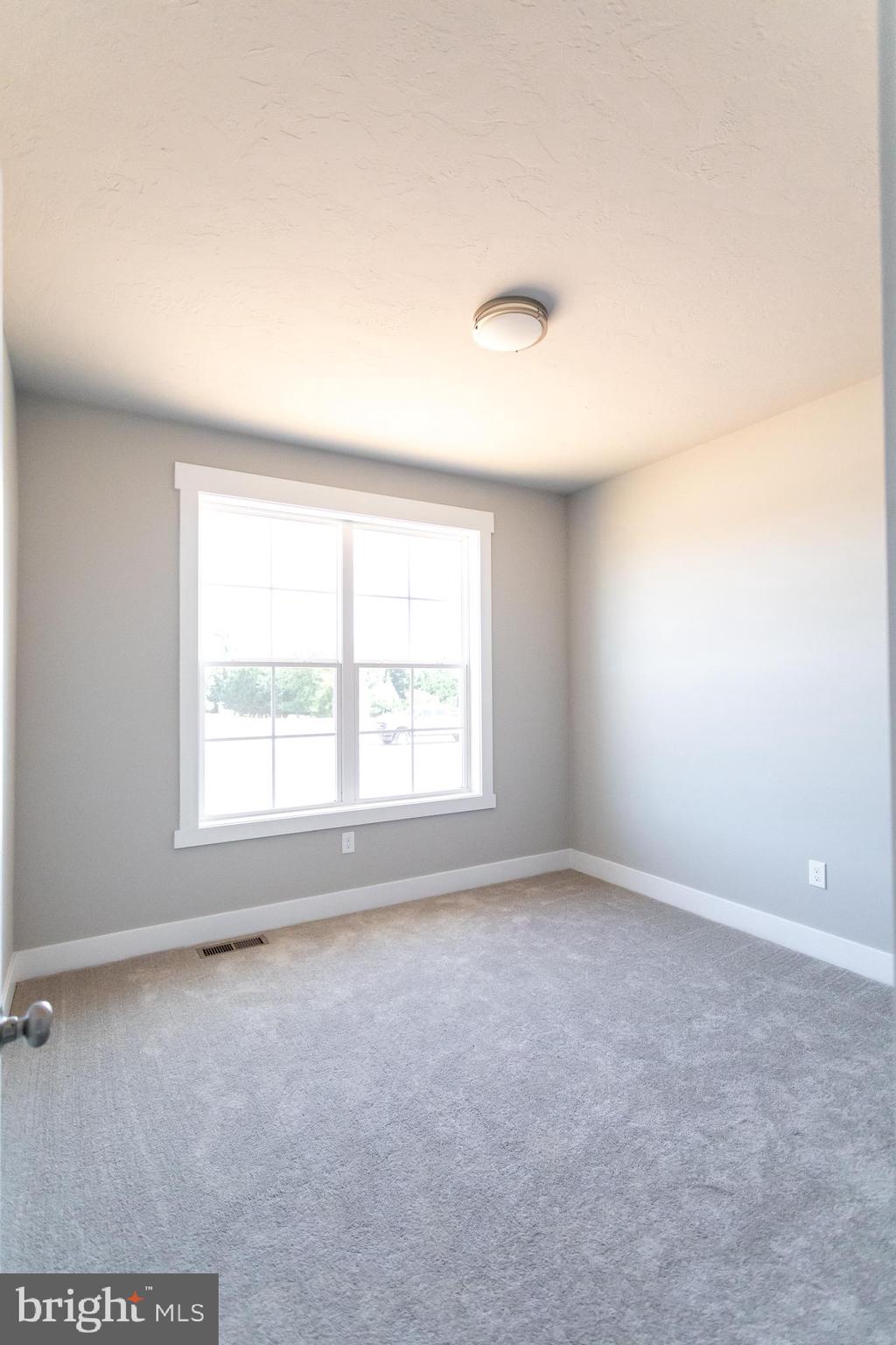 310 Steeple View Drive, Unit 18 Hanover, PA 17331 - Photo 17 of 24 an empty room with a window
