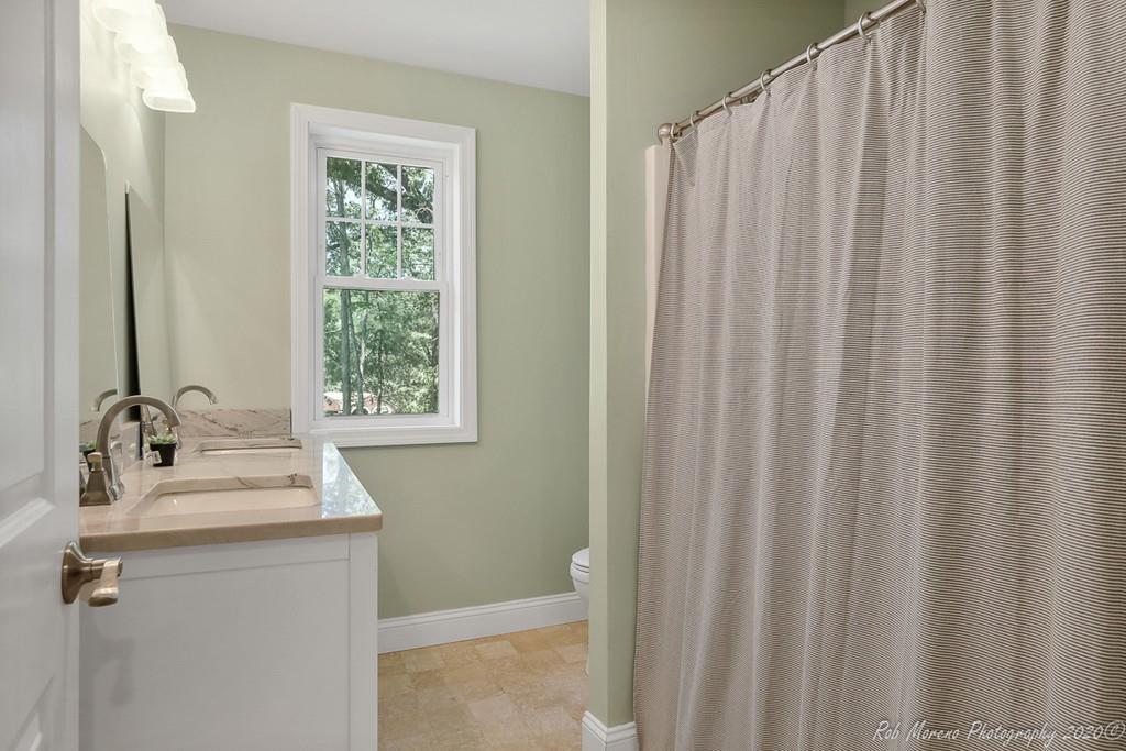 30 Folly Mill Road Salisbury, MA 01952 - Photo 23 of 42 a bathroom with a sink a mirror and a shower