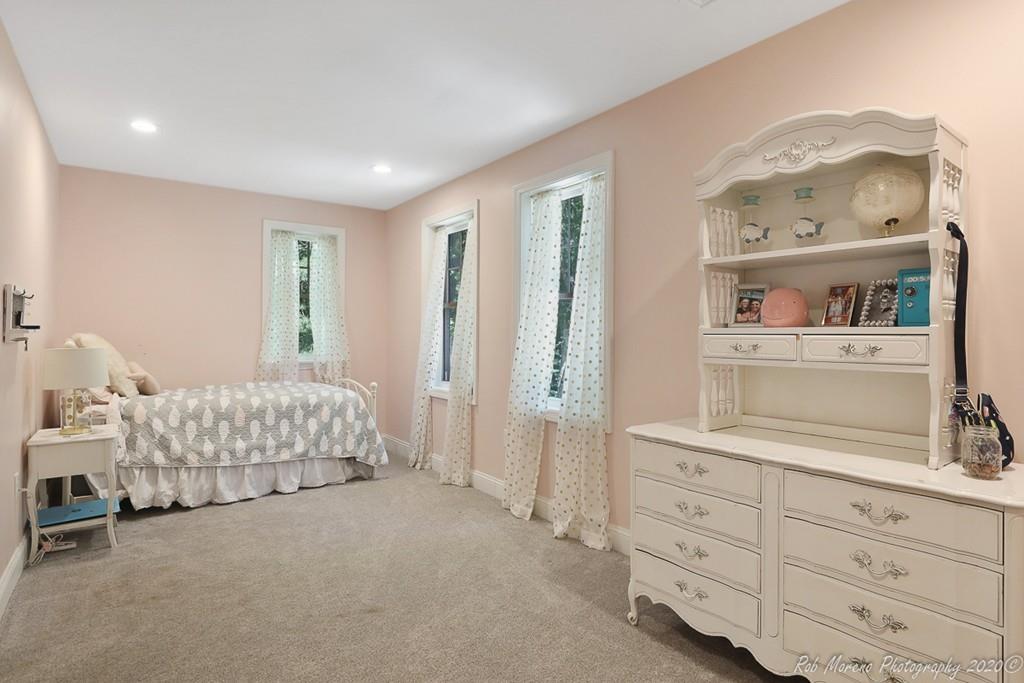 30 Folly Mill Road Salisbury, MA 01952 - Photo 24 of 42 a bedroom with a bed and a cabinets