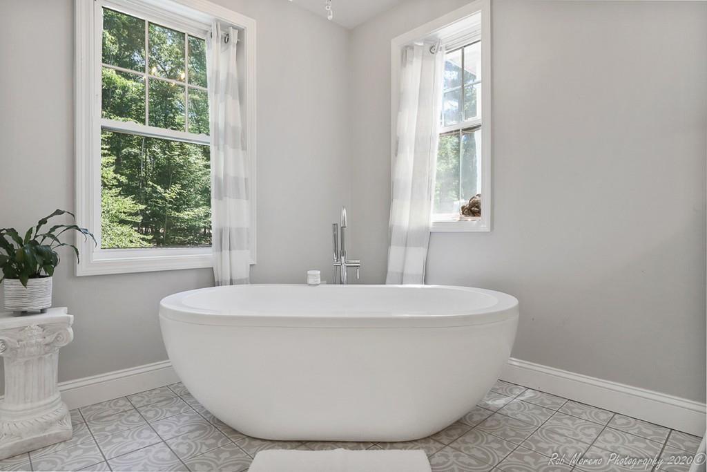 30 Folly Mill Road Salisbury, MA 01952 - Photo 33 of 42 a white bath tub sitting in a bathroom next to a window