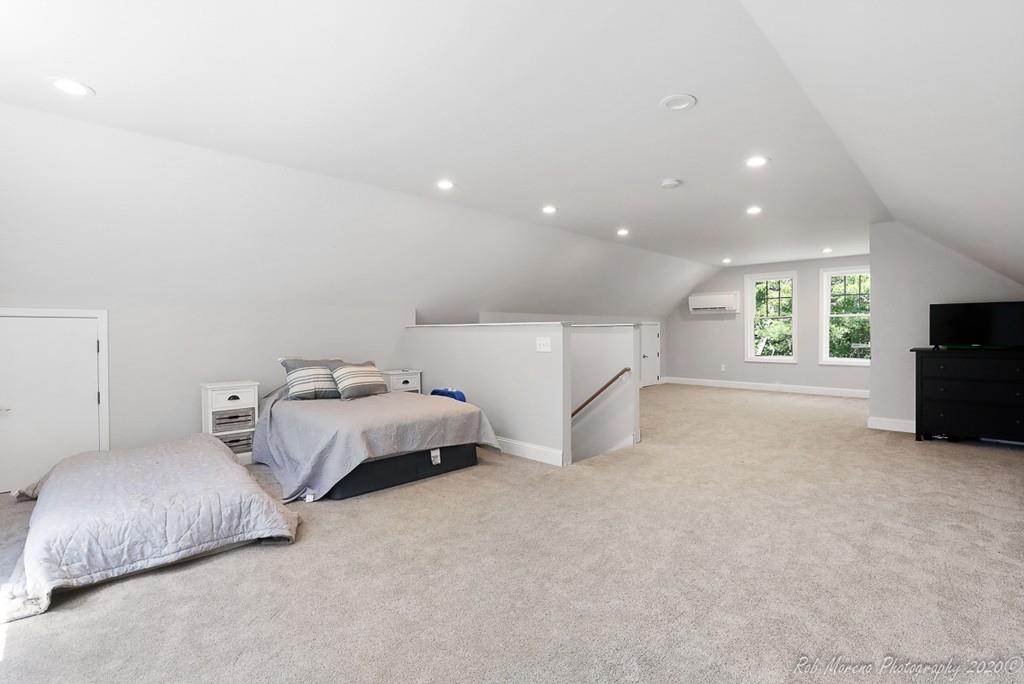 30 Folly Mill Road Salisbury, MA 01952 - Photo 34 of 42 a spacious bedroom with a bed and a couch