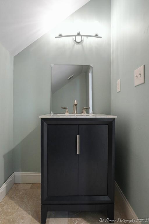 30 Folly Mill Road Salisbury, MA 01952 - Photo 35 of 42 a bathroom with a sink a mirror and vanity