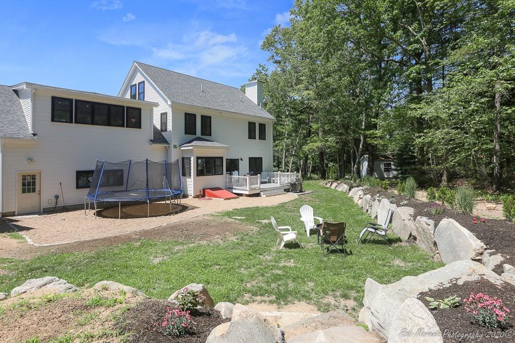 30 Folly Mill Road Salisbury, MA 01952 - Photo 36 of 42 a view of a house with backyard and sitting area