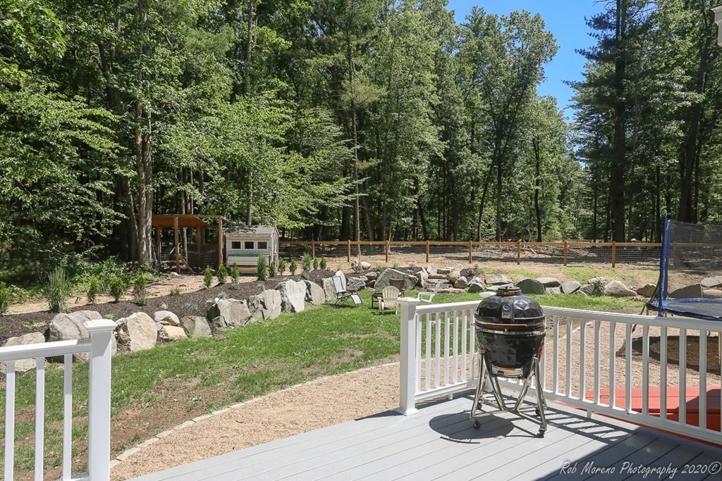 30 Folly Mill Road Salisbury, MA 01952 - Photo 40 of 42 a table and chairs with the trees in front of it