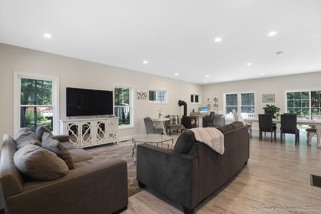 30 Folly Mill Road Salisbury, MA 01952 - Photo 5 of 42 a living room with furniture flat screen tv and a large window