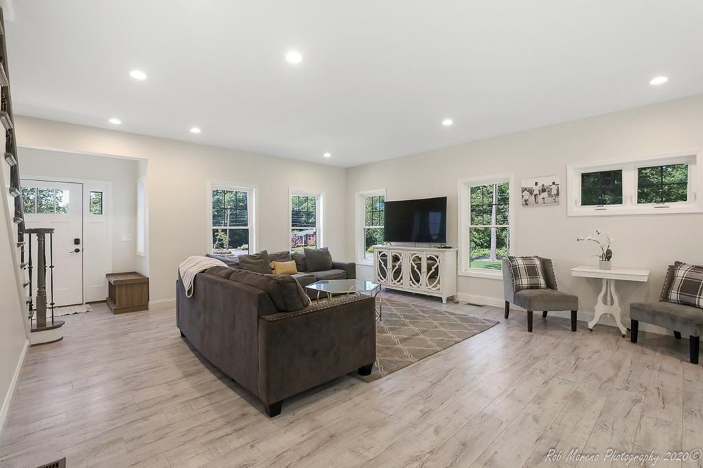 30 Folly Mill Road Salisbury, MA 01952 - Photo 6 of 42 a living room with furniture and a flat screen tv