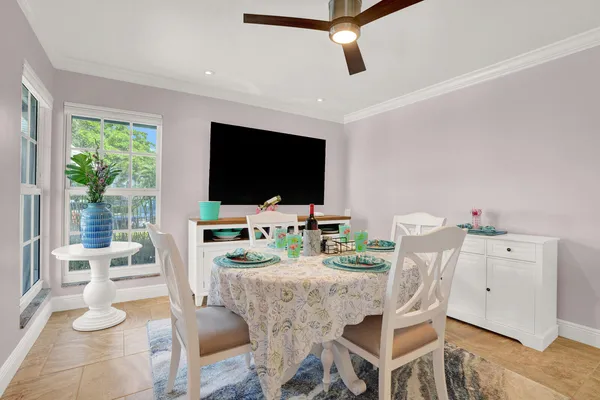 a bathroom with a granite countertop sink toilet mirror and shower