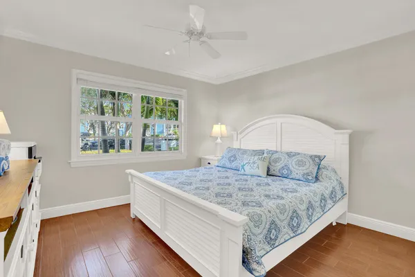 a view of patio with a table and chairs under an umbrella