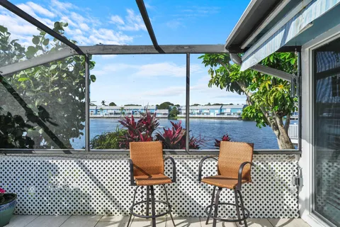 a patio with a patio table and chairs