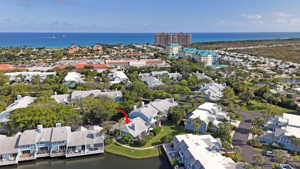 an aerial view of a house with outdoor space