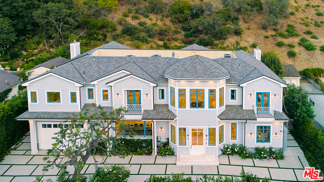 930 Roscomare Road Los Angeles, CA 90077 - Photo 1 of 54 a aerial view of a brick house next to a yard