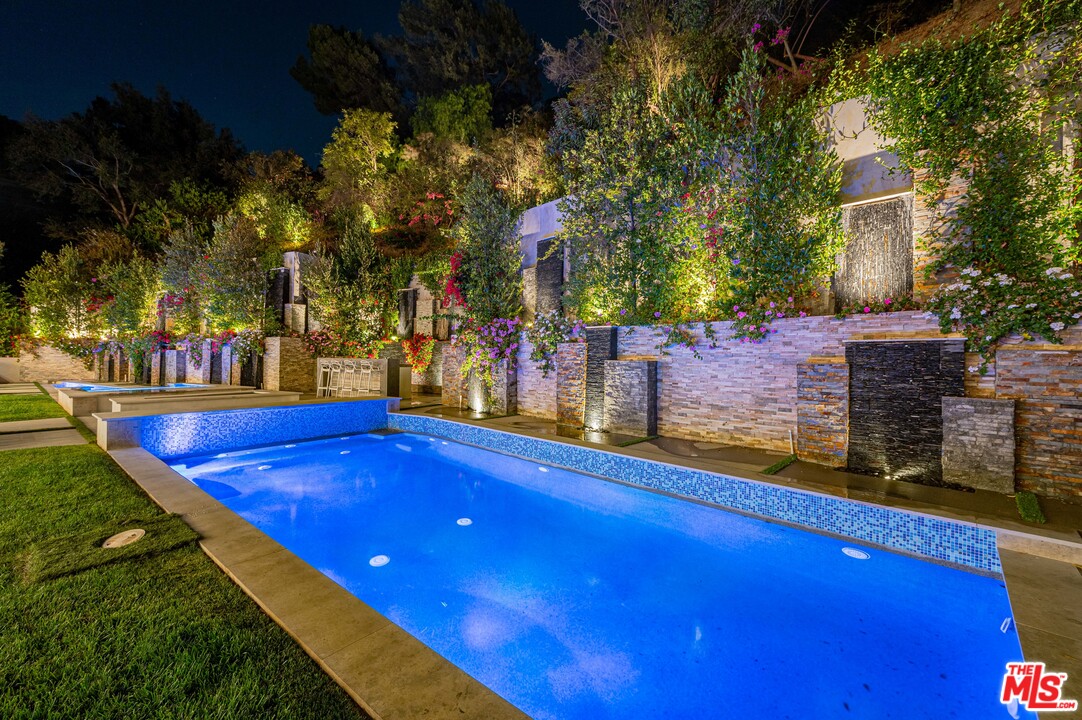 930 Roscomare Road Los Angeles, CA 90077 - Photo 14 of 54 a view of swimming pool with outdoor seating
