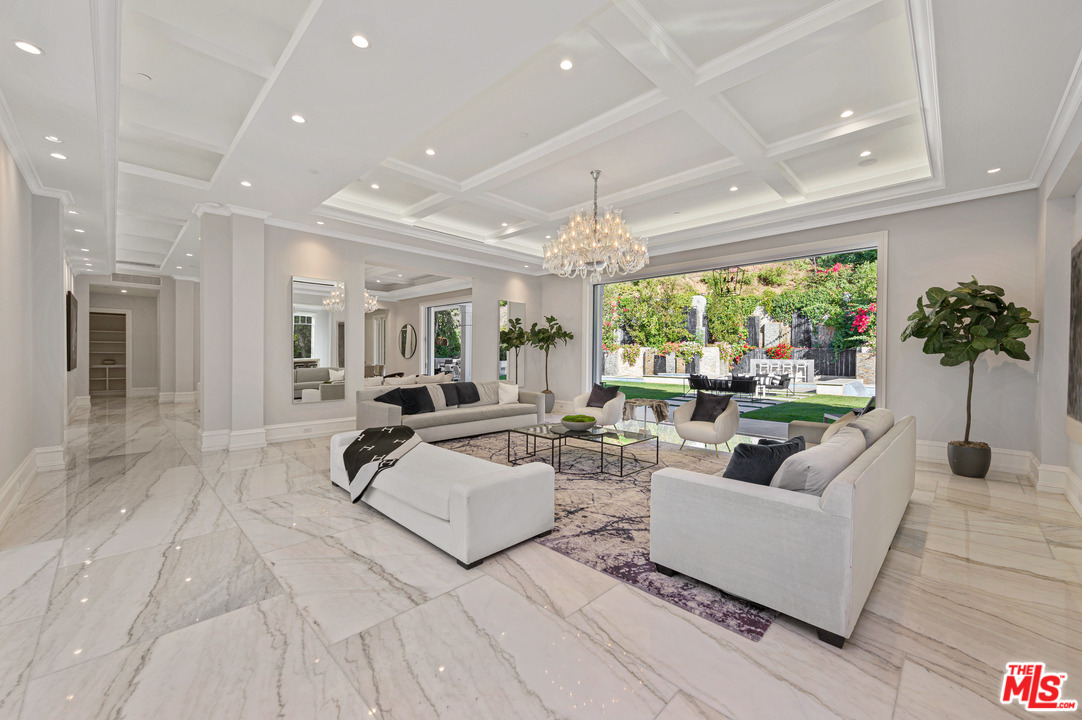 930 Roscomare Road Los Angeles, CA 90077 - Photo 23 of 54 a living room with furniture and a large window