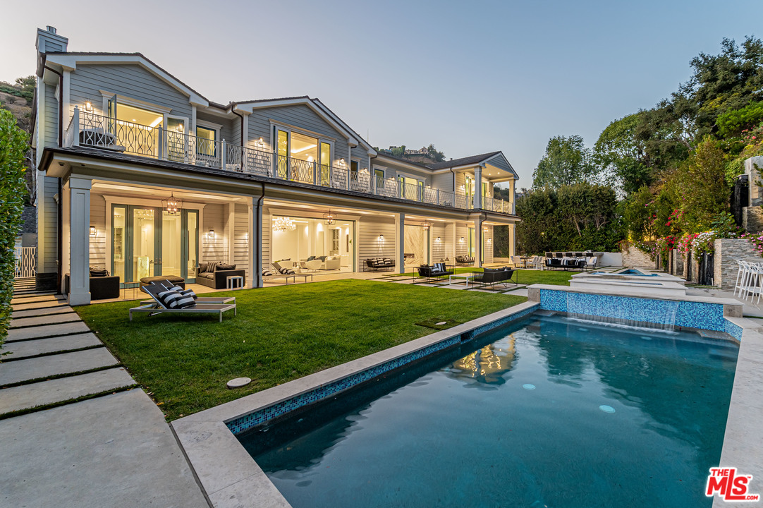 930 Roscomare Road Los Angeles, CA 90077 - Photo 4 of 54 a front view of building with yard