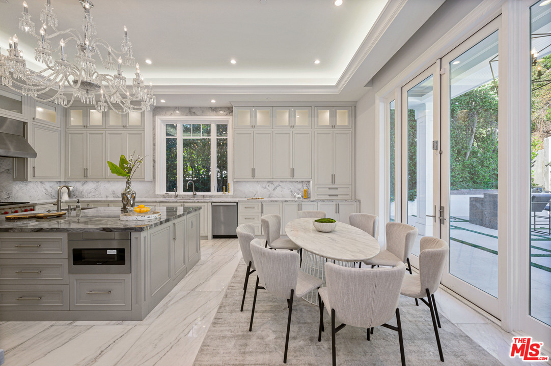 930 Roscomare Road Los Angeles, CA 90077 - Photo 33 of 54 a kitchen with a sink and stove top oven