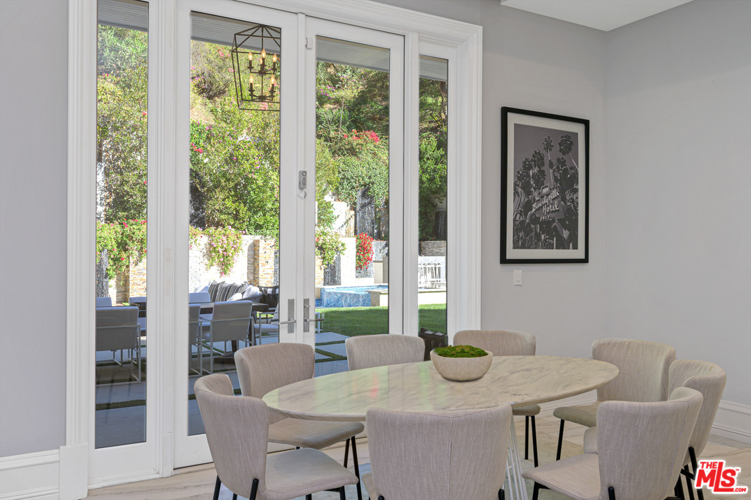 930 Roscomare Road Los Angeles, CA 90077 - Photo 36 of 54 a view of a dining room with furniture window and outside view