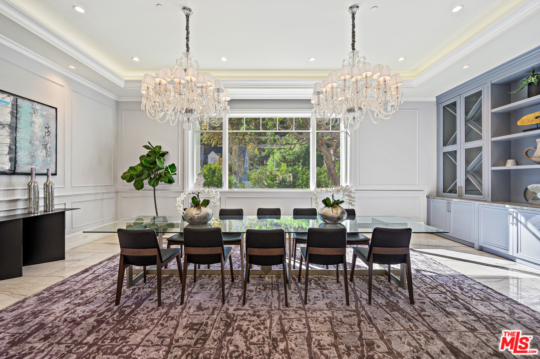930 Roscomare Road Los Angeles, CA 90077 - Photo 37 of 54 a view of a dining room with furniture window and chandelier
