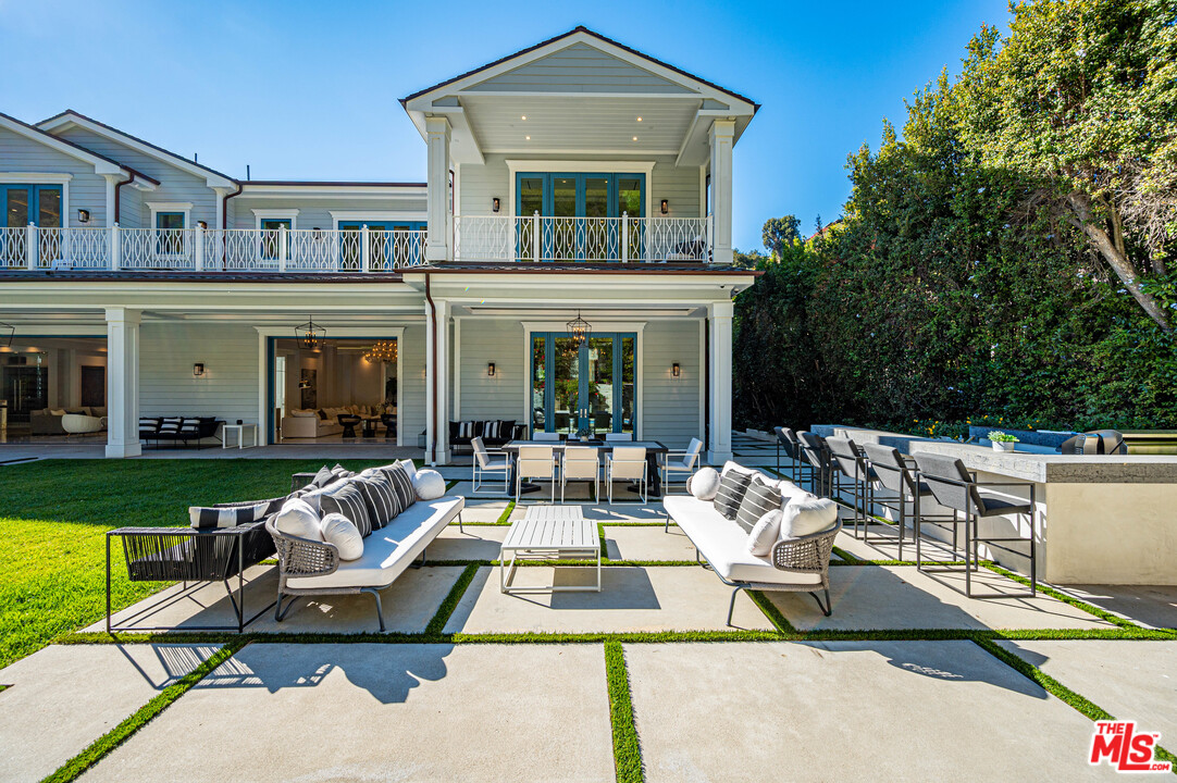 930 Roscomare Road Los Angeles, CA 90077 - Photo 7 of 54 a view of a patio with couches table and chairs with garden view