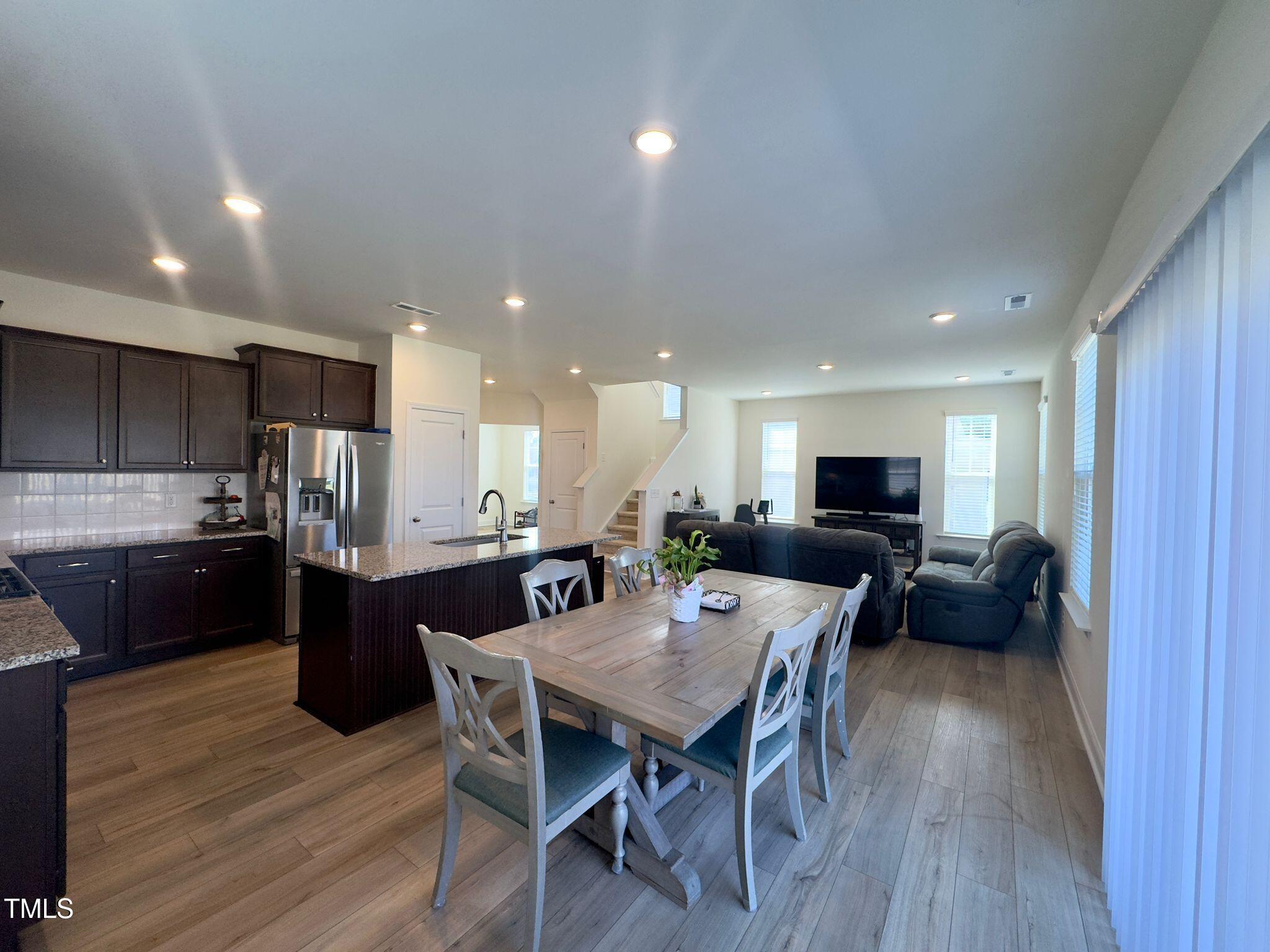 47 Flowing River Road Angier, NC 27501 - Photo 13 of 38 a kitchen with a table and chairs in it