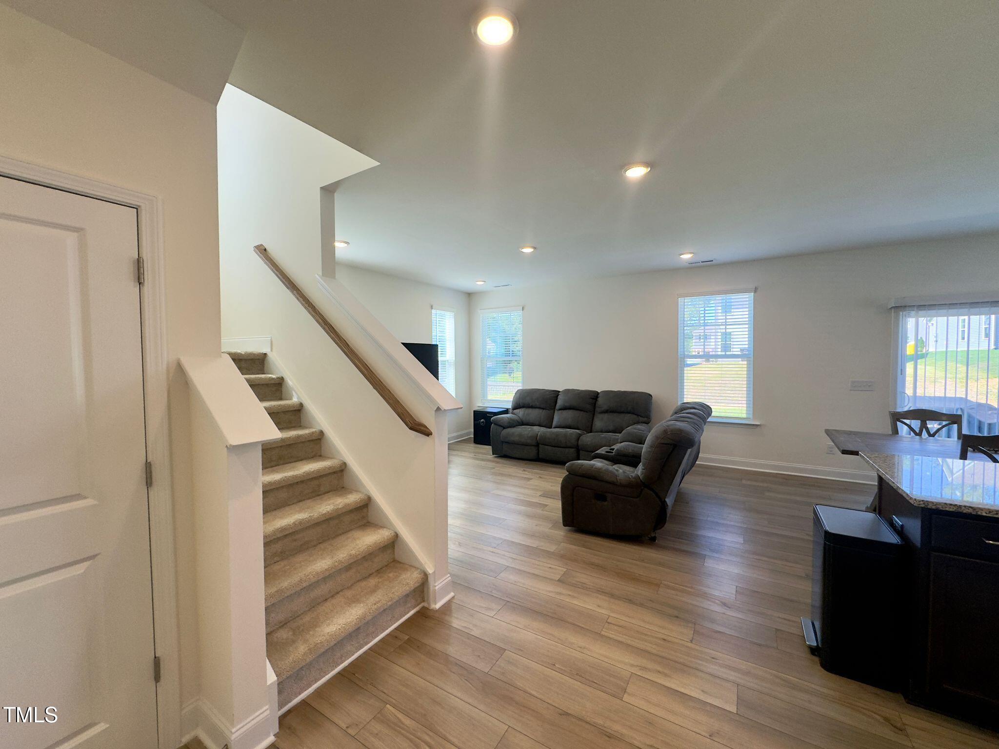 47 Flowing River Road Angier, NC 27501 - Photo 20 of 38 a living room with furniture and a wooden floor