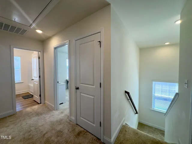 a view of a hallway to other room