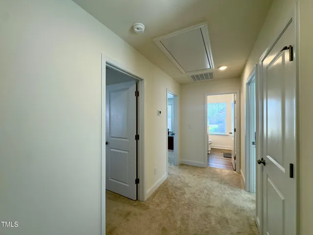 a view of a hallway with closet area