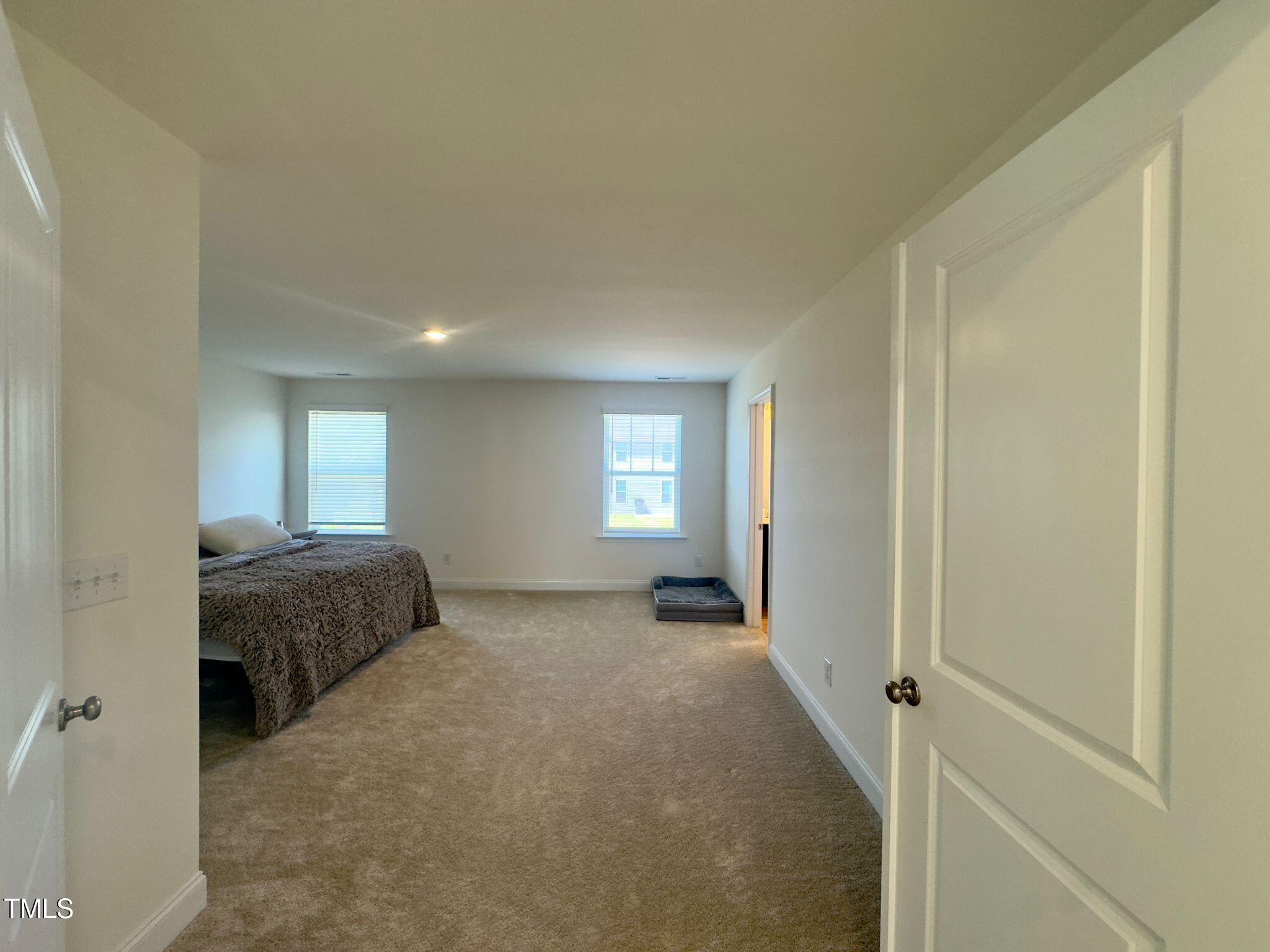 47 Flowing River Road Angier, NC 27501 - Photo 23 of 38 a room with a bed and a window
