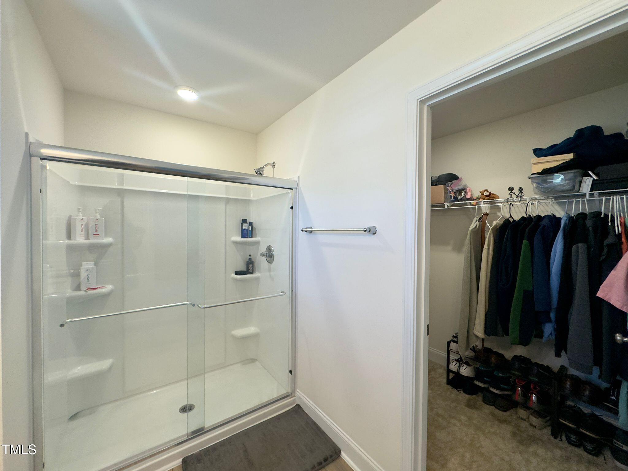 47 Flowing River Road Angier, NC 27501 - Photo 28 of 38 a bathroom with a shower and a mirror
