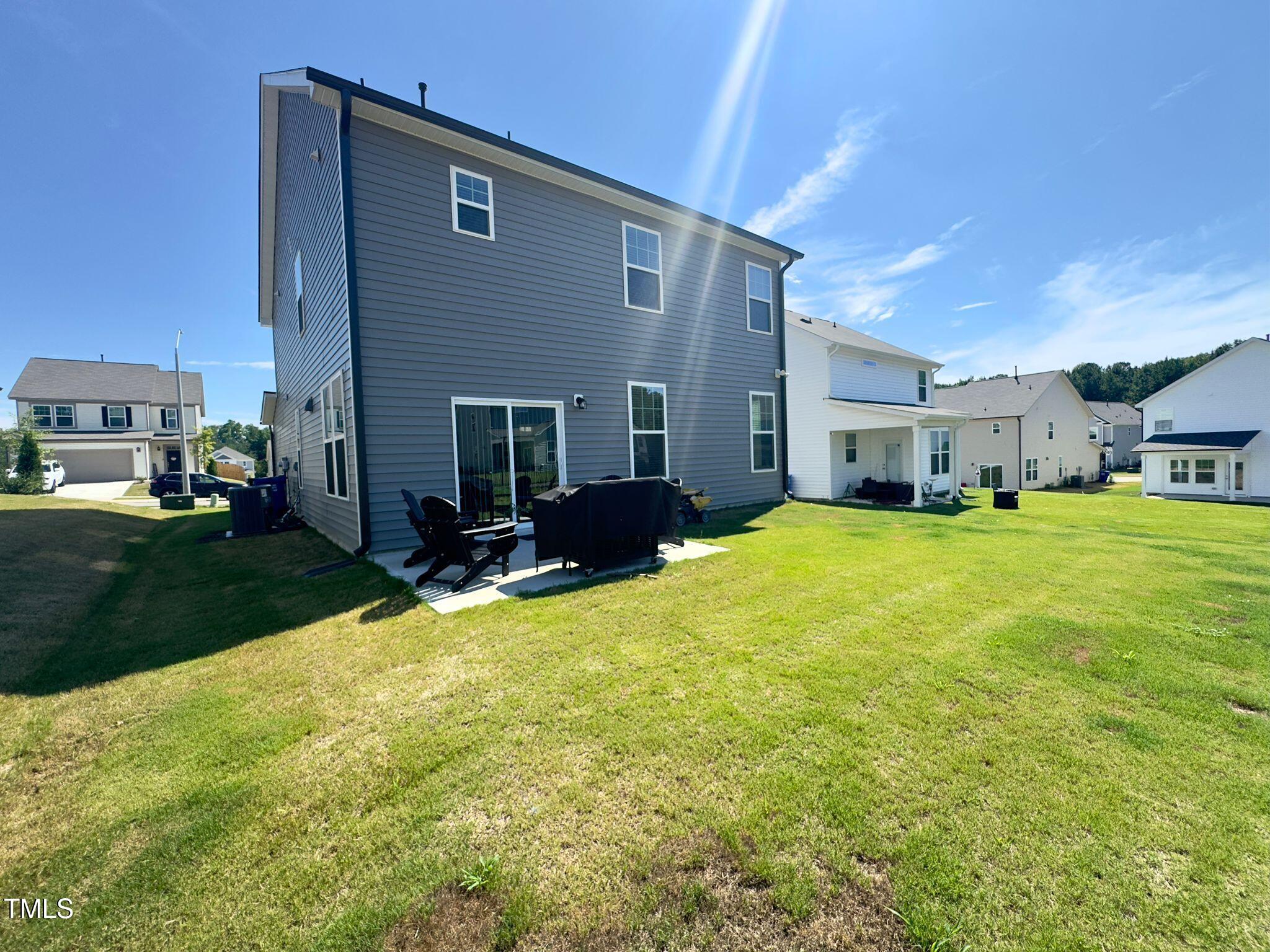 47 Flowing River Road Angier, NC 27501 - Photo 37 of 38 a view of house with yard and deck in the backyard