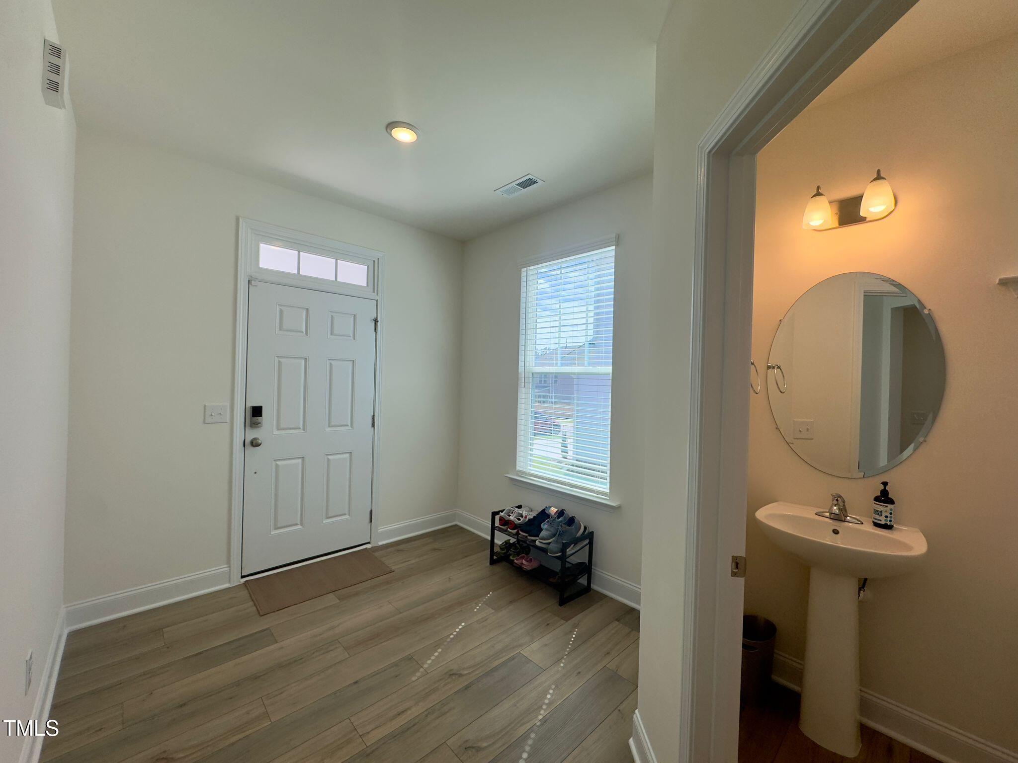 47 Flowing River Road Angier, NC 27501 - Photo 5 of 38 a view of a room with wooden floor and windows