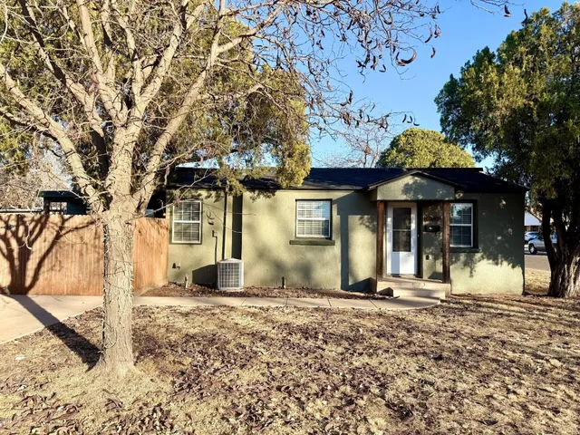 a view of a house with a snow in the yard