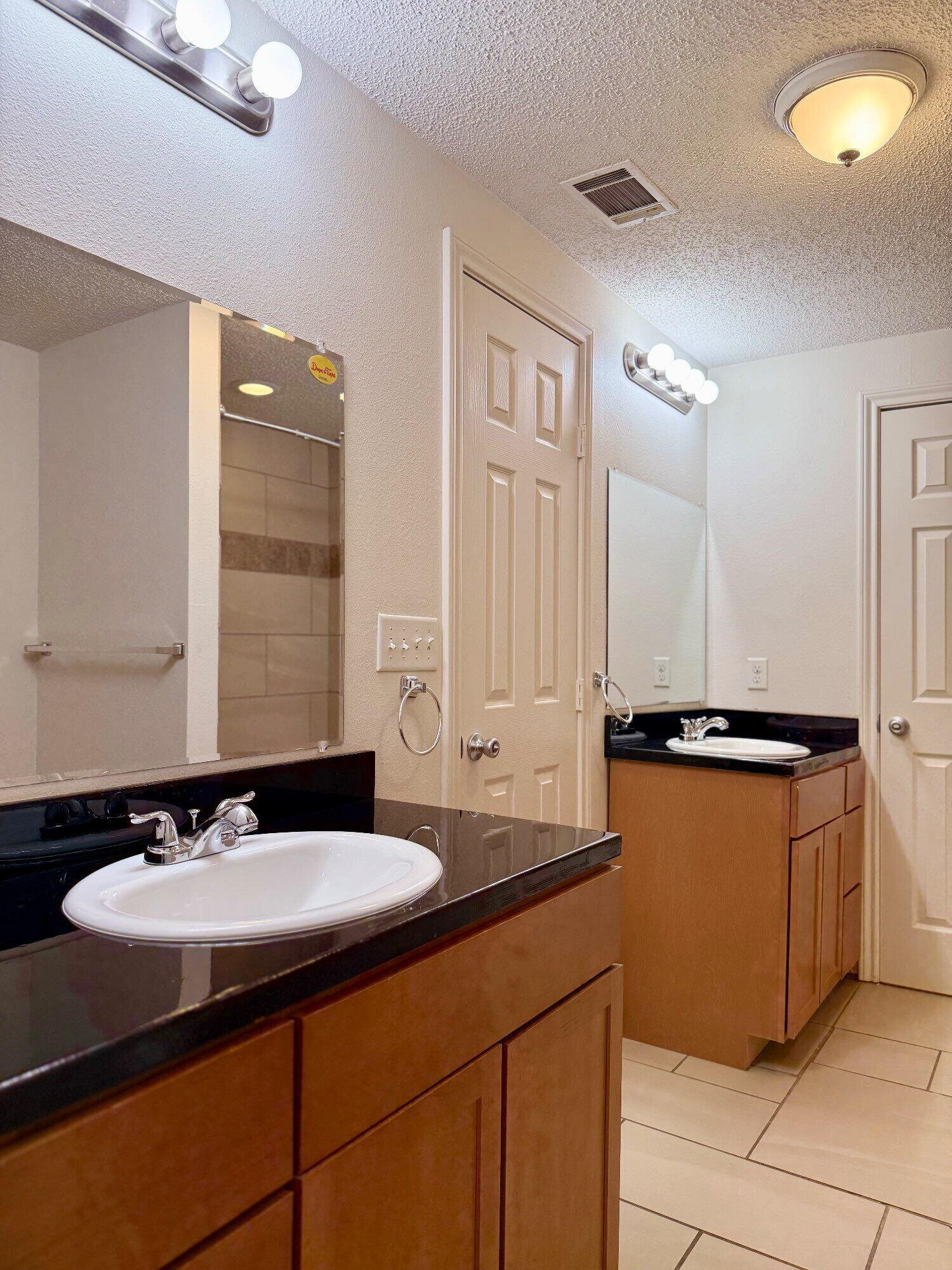 3607 Gary Avenue Lubbock, TX 79413 - Photo 16 of 26 a bathroom with a sink and a mirror