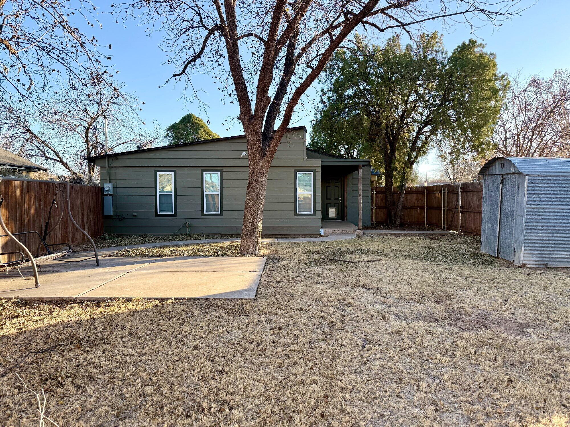 3607 Gary Avenue Lubbock, TX 79413 - Photo 26 of 26 a front view of house with yard and trees in the background